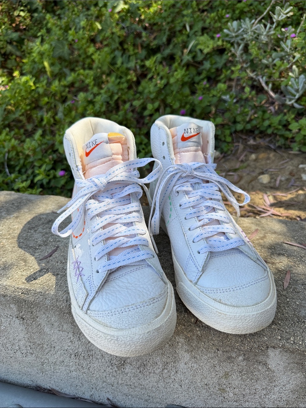 Nike White High-Top Sneakers with Orange and Pink Accents